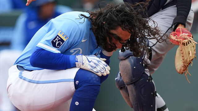 KANSAS CITY, MISSOURI - MARCH 30: Jonathan India #6 of the Kansas City Royals is hit by a Cleveland Guardians during the ninth inning at Kauffman Stadium on March 30, 2025 in Kansas City, Missouri.