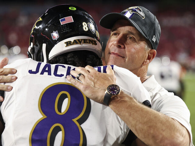 TAMPA, FLORIDA - OCTOBER 21: Lamar Jackson #8 of the Baltimore Ravens talks with John Harbaugh of the Baltimore Ravens prior to an NFL football game against the Tampa Bay Buccaneers at Raymond James Stadium on October 21, 2024 in Tampa, Florida.