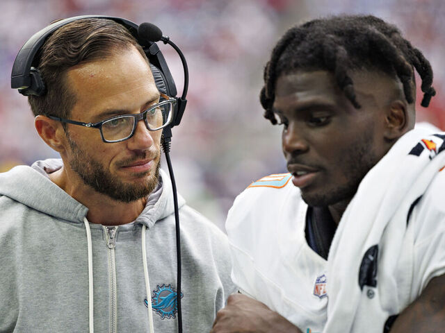 HOUSTON, TEXAS - AUGUST 19: Tyreek Hill #10 talks with Head Coach Mike McDaniel of the Miami Dolphins on the sidelines during the preseason game against the Houston Texans at NRG Stadium on August 19, 2023 in Houston, Texas. The Dolphins defeated the Texans 28-3.