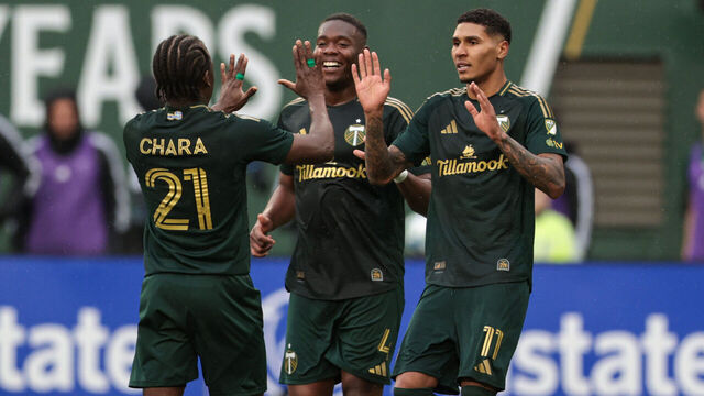 PORTLAND, OREGON - MARCH 30: Antony #11 of Portland Timbers celebrates with teammates Kamal Miller #4 and Diego Chará #21 after scoring during the second half of a game Houston Dynamo at Providence Park on March 30, 2025 in Portland, Oregon.