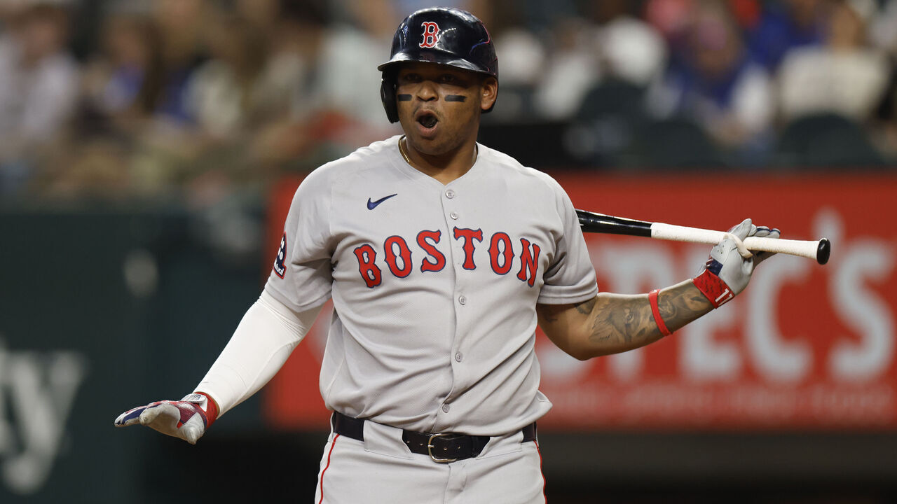 ARLINGTON, TX - MARCH 29: Rafael Devers #11 of the Boston Red Sox reacts during an at bat against the Texas Rangers during the second inning at Globe Life Field on March 29, 2025 in Arlington, Texas.