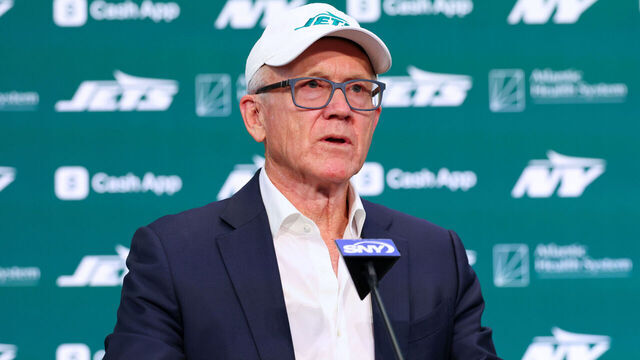 FLORHAM PARK, NEW JERSEY - JANUARY 27: New York Jets owner Woody Johnson speaks at the press conference announcing the hiring of new head coach Aaron Glenn and general manager Darren Mougey at Atlantic Health Jets Training Center on January 27, 2025 in Florham Park, New Jersey.