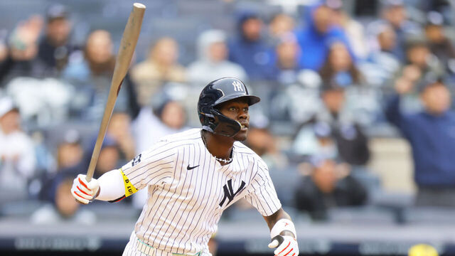 NEW YORK, NEW YORK - MARCH 30: Jazz Chisholm Jr. #13 of the New York Yankees hits a 2-run home run in the third inning against the Milwaukee Brewers at Yankee Stadium on March 30, 2025 in New York City.