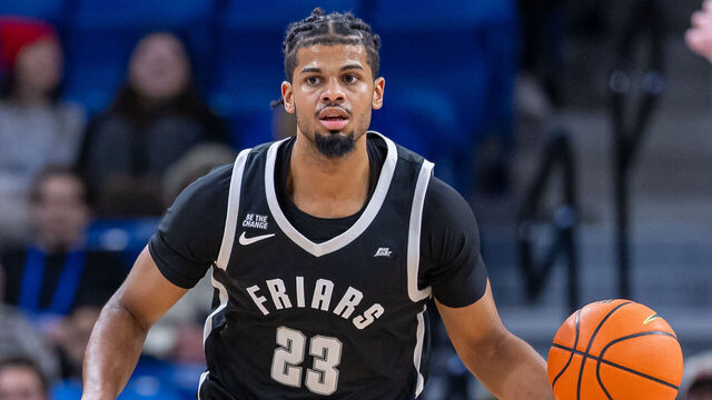 CHICAGO, ILLINOIS - DECEMBER 10: Bryce Hopkins #23 of the Providence Friars brings the ball up court during the game against the DePaul Blue Demons at Wintrust Arena on December 10, 2024 in Chicago, Illinois.