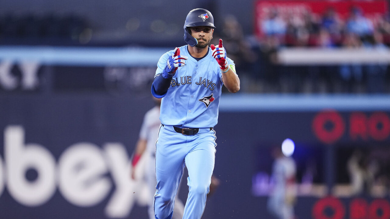 TORONTO, ON - MARCH 31: Andres Gimenez #0 of the Toronto Blue Jays celebrates his home run against the Washington Nationals during the second inning in their MLB game at the Rogers Centre on March 31, 2025 in Toronto, Ontario, Canada.