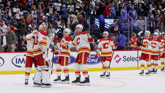 DENVER, COLORADO - MARCH 31: Goaltender Dan Vladar #80 and members of the Calgary Flames celebrate a shootout win against the Colorado Avalanche at Ball Arena on March 31, 2025 in Denver, Colorado.