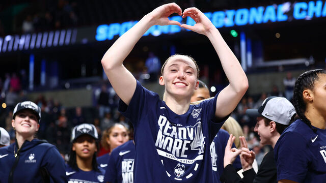 SPOKANE, WASHINGTON - MARCH 31: Paige Bueckers #5 of the UConn Huskies celebrates on the court with her teammates after beating the USC Trojans 78-64 to advance to the Final Four during the Elite Eight round of the 2025 NCAA Women's Basketball Tournament held at Spokane Arena on March 31, 2025 in Spokane, Washington.