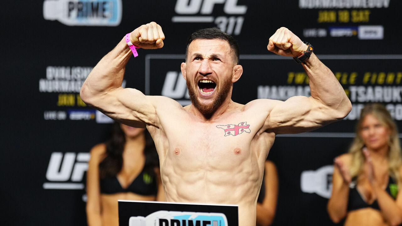 INGLEWOOD, CALIFORNIA - JANUARY 17: Merab Dvalishvili of Georgia poses on the scale during the UFC 311 ceremonial weigh-in at Intuit Dome on January 17, 2025 in Inglewood, California.
