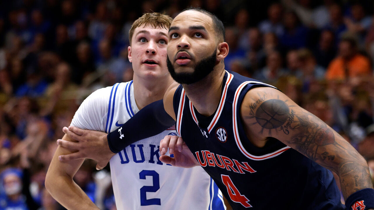 DURHAM, NORTH CAROLINA - DECEMBER 4: Johni Broome #4 of the Auburn Tigers boxes out against Cooper Flagg #2 of the Duke Blue Devils during the first half of the game at Cameron Indoor Stadium on December 4, 2024 in Durham, North Carolina.