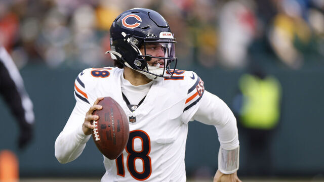 GREEN BAY, WISCONSIN - JANUARY 05: Caleb Williams #18 of the Chicago Bears scrambles in the fourth quarter against the Green Bay Packers at Lambeau Field on January 05, 2025 in Green Bay, Wisconsin.