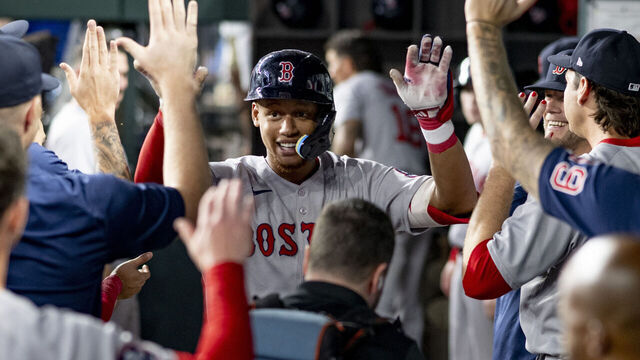 ARLINGTON, TEXAS - MARCH 29: Kristian Campbell #29 of the Boston Red Sox reacts after hitting his first Major League home run during the fourth inning of a game against the Texas Rangers on March 29, 2025 at Globe Life Field in Arlington, Texas.