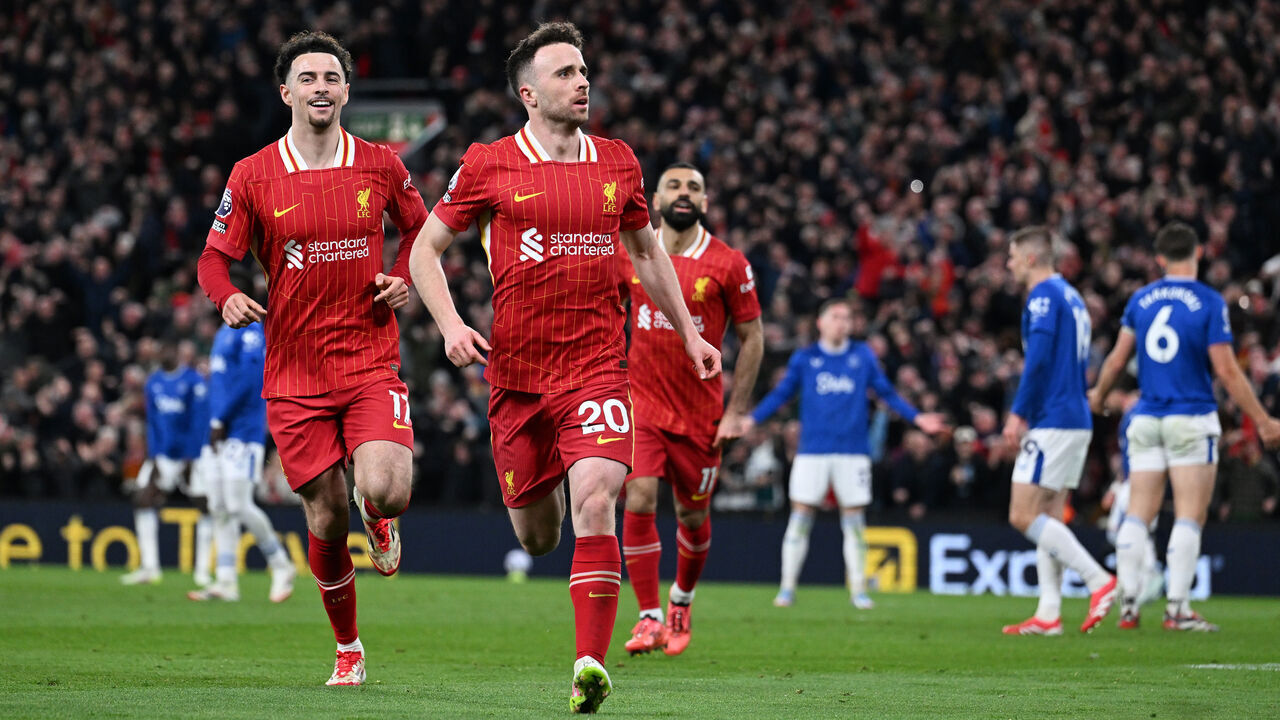 LIVERPOOL, ENGLAND - APRIL 02: (THE SUN OUT, THE SUN ON SUNDAY OUT) Diogo Jota of Liverpool celebrates scoring his team's first goal during the Premier League match between Liverpool FC and Everton FC at Anfield on April 02, 2025 in Liverpool, England.