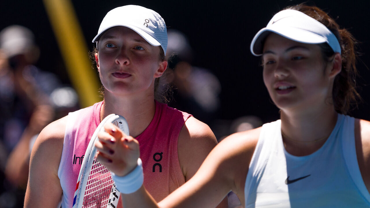 MELBOURNE, AUSTRALIA - JANUARY 18: Iga Swiatek (L) of Poland greets Emma Raducanu of Great Britain at the net after victory in the Women's Singles Third Round match during day seven of the 2025 Australian Open at Melbourne Park on January 18, 2025 in Melbourne, Australia.