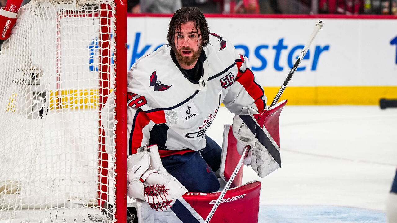 RALEIGH, NORTH CAROLINA - APRIL 02: Logan Thompson #48 of the Washington Capitals looks on after losing his mask during the first period against the Carolina Hurricanes at Lenovo Center on April 2, 2025 in Raleigh, North Carolina.
