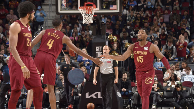 CLEVELAND, OH - APRIL 2: Evan Mobley #4 and Donovan Mitchell #45 of the Cleveland Cavaliers high five during the game against the New York Knicks on April 2, 2025 at Rocket Arena in Cleveland, Ohio. NOTE TO USER: User expressly acknowledges and agrees that, by downloading and/or using this Photograph, user is consenting to the terms and conditions of the Getty Images License Agreement. Mandatory Copyright Notice: Copyright 2025 NBAE