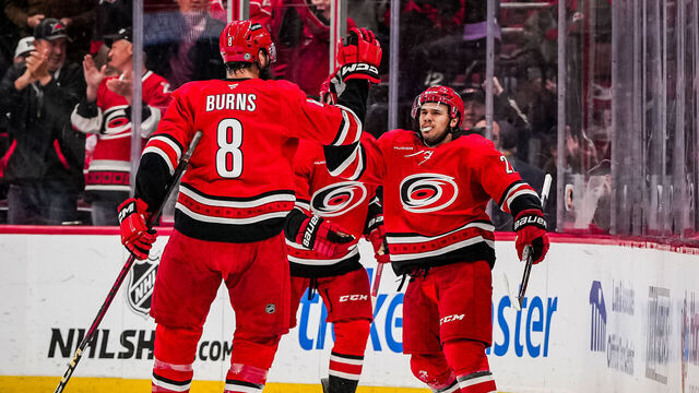 RALEIGH, NORTH CAROLINA - APRIL 02: Logan Stankoven #22 of the Carolina Hurricanes celebrates with teammates after a goal during the second period against the Washington Capitals at Lenovo Center on April 2, 2025 in Raleigh, North Carolina.