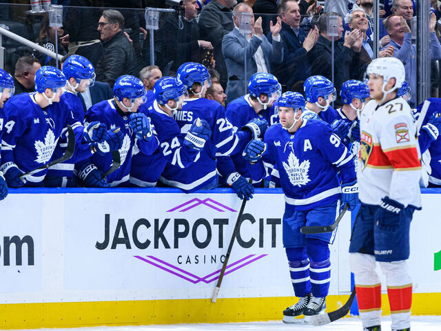 TORONTO, ON - APRIL 02: Toronto Maple Leafs Center John Tavares (91) celebrates his goal by the team bench during the second period of the NHL regular season game between the Florida Panthers and the Toronto Maple Leafs on April 2, 2025, at Scotiabank Arena in Toronto, ON, Canada.