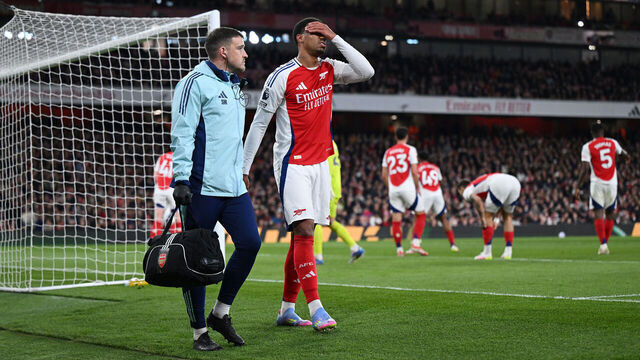 LONDON, ENGLAND - APRIL 01: Gabriel of Arsenal looks dejected as he leaves the pitch with a member of the medical team after picking up an injury during the Premier League match between Arsenal FC and Fulham FC at Emirates Stadium on April 01, 2025 in London, England.