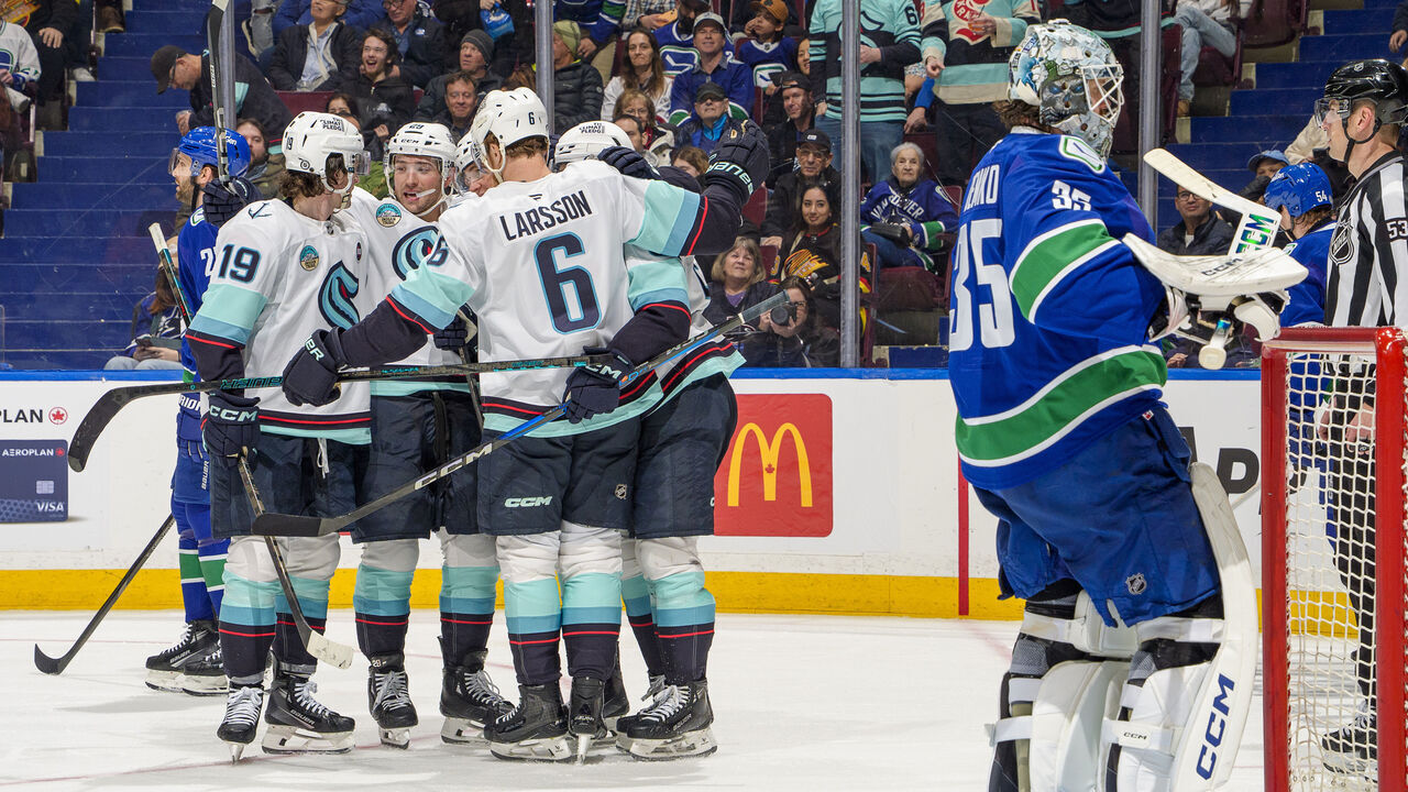 VANCOUVER, CANADA - APRIL 2: Andre Burakovsky #95 of the Seattle Kraken celebrates his goal with teammates during the third period of their NHL game against the Vancouver Canucks at Rogers Arena on April 2, 2025 in Vancouver, British Columbia, Canada.