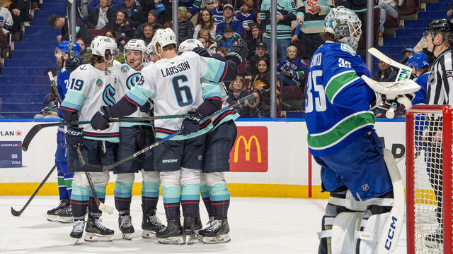 VANCOUVER, CANADA - APRIL 2: Andre Burakovsky #95 of the Seattle Kraken celebrates his goal with teammates during the third period of their NHL game against the Vancouver Canucks at Rogers Arena on April 2, 2025 in Vancouver, British Columbia, Canada.