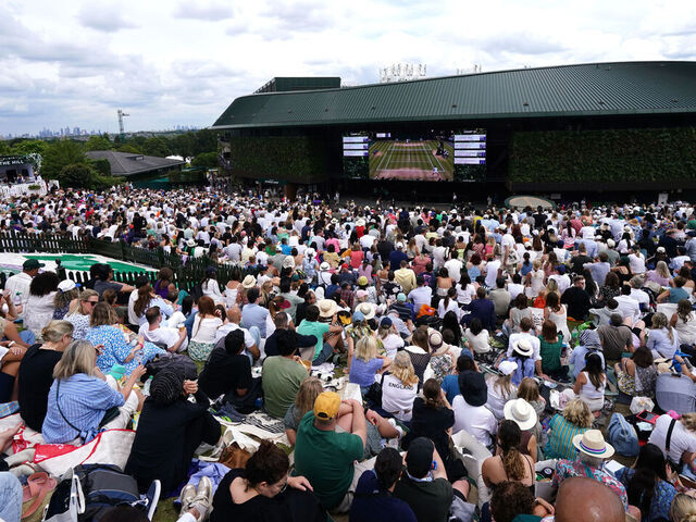 Spectators on the hill outside Court One ahead of the Gentlemen's Singles Final between Carlos Alcaraz and Novak Djokovic on day fourteen of the 2024 Wimbledon Championships at the All England Lawn Tennis and Croquet Club, London. Picture date: Sunday July 14, 2024.