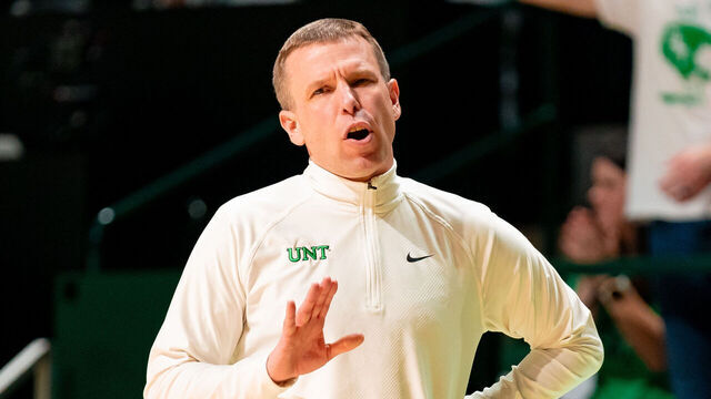 DENTON, TX - FEBRUARY 15: North Texas Mean Green head coach Ross Hodge slows his team down during a college basketball game between Memphis Tigers and the North Texas Mean Green on February 15, 2024 at The Super Pit in Denton, TX.