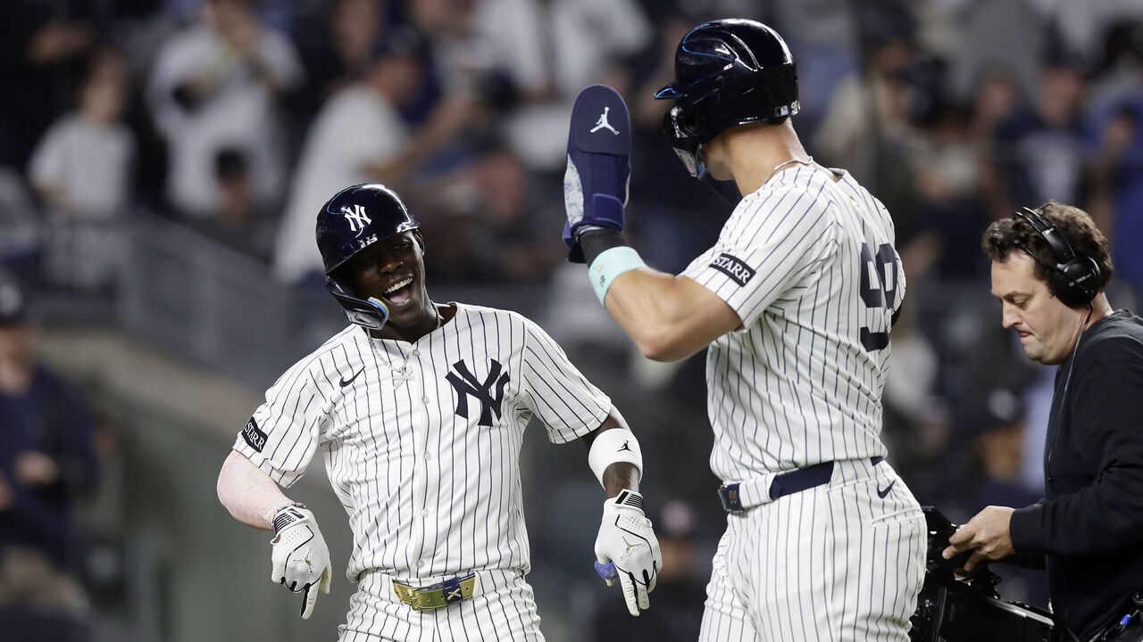 NEW YORK, NEW YORK - APRIL 03: Jazz Chisholm Jr. #13 of the New York Yankees celebrates his fourth inning two-run home run against the Arizona Diamondbacks with teammate Aaron Judge #99 at Yankee Stadium on April 03, 2025 in New York City.