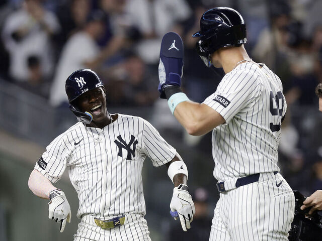 NEW YORK, NEW YORK - APRIL 03: Jazz Chisholm Jr. #13 of the New York Yankees celebrates his fourth inning two-run home run against the Arizona Diamondbacks with teammate Aaron Judge #99 at Yankee Stadium on April 03, 2025 in New York City.