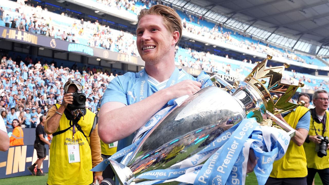 Manchester City's Kevin De Bruyne celebrates with the Premier League trophy after the Premier League match at the Etihad Stadium, Manchester. Picture date: Sunday May 19, 2024.