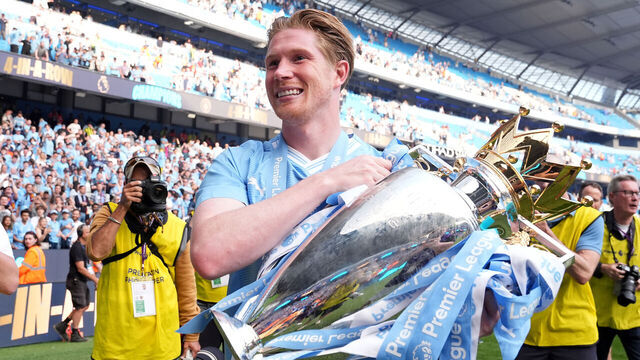 Manchester City's Kevin De Bruyne celebrates with the Premier League trophy after the Premier League match at the Etihad Stadium, Manchester. Picture date: Sunday May 19, 2024.