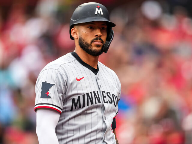ST LOUIS, MO - MARCH 29: Carlos Correa #4 of the Minnesota Twins looks on against the St. Louis Cardinals on March 29, 2025 at Busch Stadium in St. Louis, Missouri.