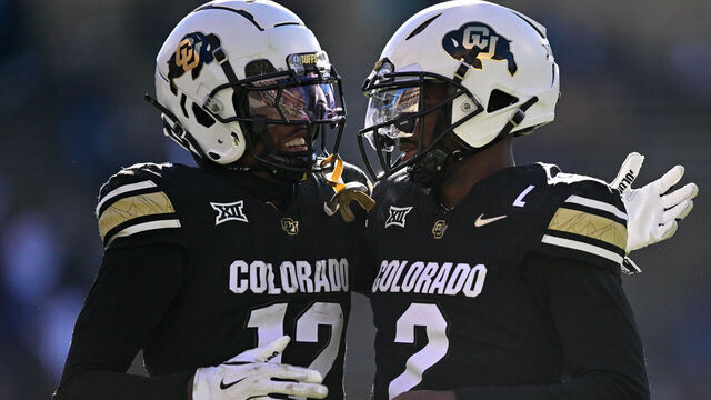 BOULDER, CO - NOVEMBER 29: Shedeur Sanders #2 and Travis Hunter #12 of the Colorado Buffaloes celebrate after a third quarter touchdown against the Oklahoma State Cowboys at Folsom Field on November 29, 2024 in Boulder, Colorado.