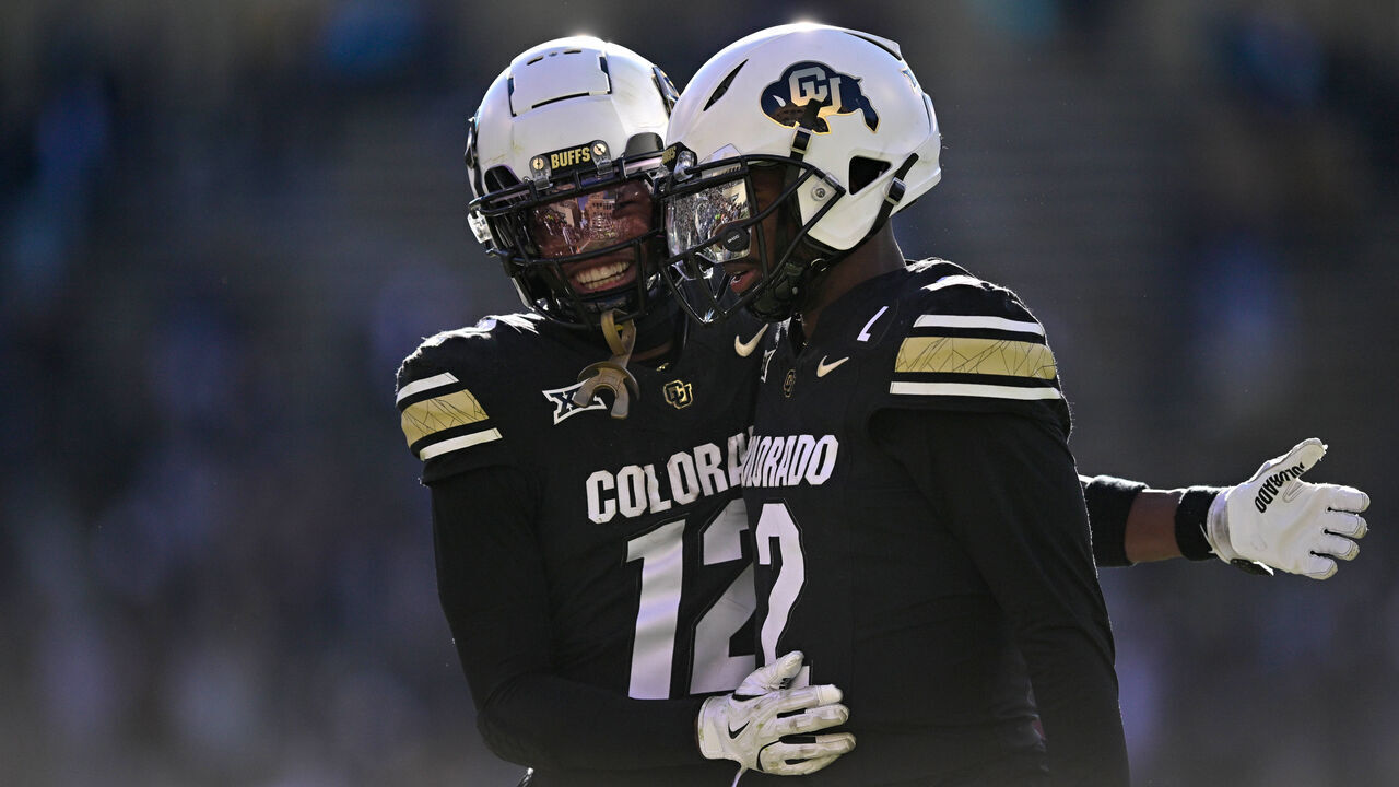 BOULDER, CO - NOVEMBER 29: Shedeur Sanders #2 and Travis Hunter #12 of the Colorado Buffaloes celebrate after a third quarter touchdown against the Oklahoma State Cowboys at Folsom Field on November 29, 2024 in Boulder, Colorado.
