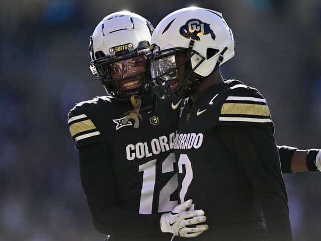 BOULDER, CO - NOVEMBER 29: Shedeur Sanders #2 and Travis Hunter #12 of the Colorado Buffaloes celebrate after a third quarter touchdown against the Oklahoma State Cowboys at Folsom Field on November 29, 2024 in Boulder, Colorado.