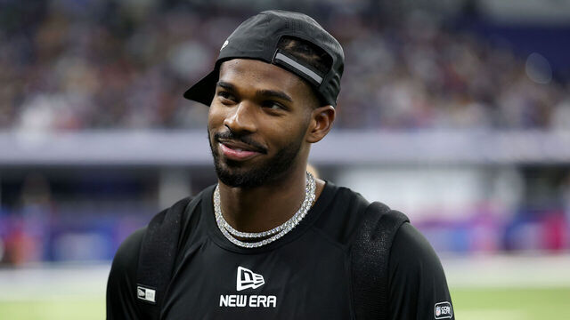 INDIANAPOLIS, INDIANA - MARCH 01: Shedeur Sanders #QB13 of Colorado looks on during the NFL Scouting Combine at Lucas Oil Stadium on March 01, 2025 in Indianapolis, Indiana.