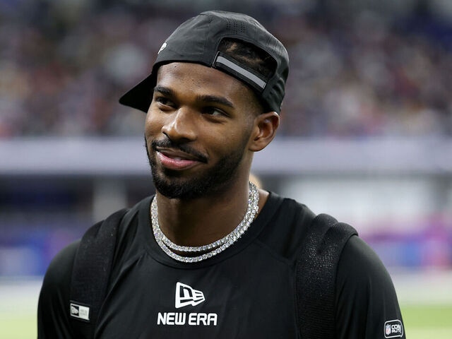 INDIANAPOLIS, INDIANA - MARCH 01: Shedeur Sanders #QB13 of Colorado looks on during the NFL Scouting Combine at Lucas Oil Stadium on March 01, 2025 in Indianapolis, Indiana.