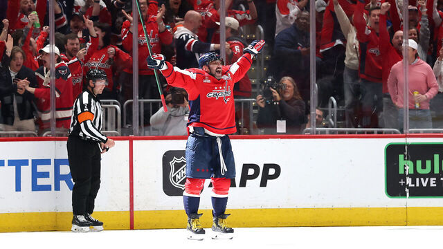WASHINGTON, DC - APRIL 04: Alex Ovechkin #8 of the Washington Capitals celebrates with teammates after scoring his 894th career goal in the third period against the Chicago Blackhawks at Capital One Arena on April 04, 2025 in Washington, DC. Ovechkin's goal ties him with Wayne Gretzky for the all-time goal scoring record.
