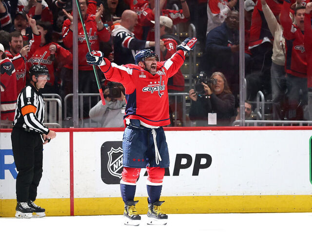 WASHINGTON, DC - APRIL 04: Alex Ovechkin #8 of the Washington Capitals celebrates with teammates after scoring his 894th career goal in the third period against the Chicago Blackhawks at Capital One Arena on April 04, 2025 in Washington, DC. Ovechkin's goal ties him with Wayne Gretzky for the all-time goal scoring record.
