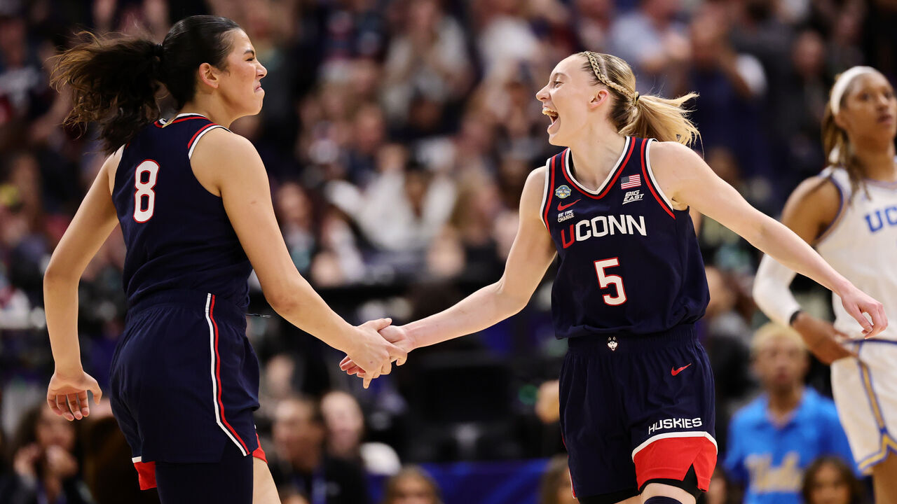 TAMPA, FLORIDA - APRIL 04: Jana El Alfy #8 and Paige Bueckers #5 of the UConn Huskies celebrate after a play against the UCLA Bruins in the second quarter in the Final Four game of the NCAA Women's Basketball Tournament at Amalie Arena on April 04, 2025 in Tampa, Florida.