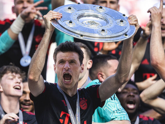 COLOGNE, GERMANY - MAY 27: Thomas Mueller of Muenchen celebrates the winning of the championship at the ceremony after the Bundesliga match between 1.FC Koeln and FC Bayern Muenchen at RheinEnergieStadion on May 27, 2023 in Cologne, Germany.