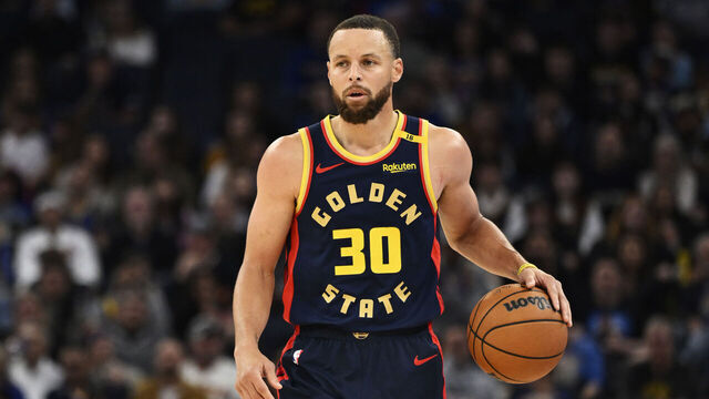 SAN FRANCISCO, CALIFORNIA - APRIL 04: Stephen Curry #30 of the Golden State Warriors dribbles against the Denver Nuggets in the third quarter at Chase Center on April 04, 2025 in San Francisco, California.