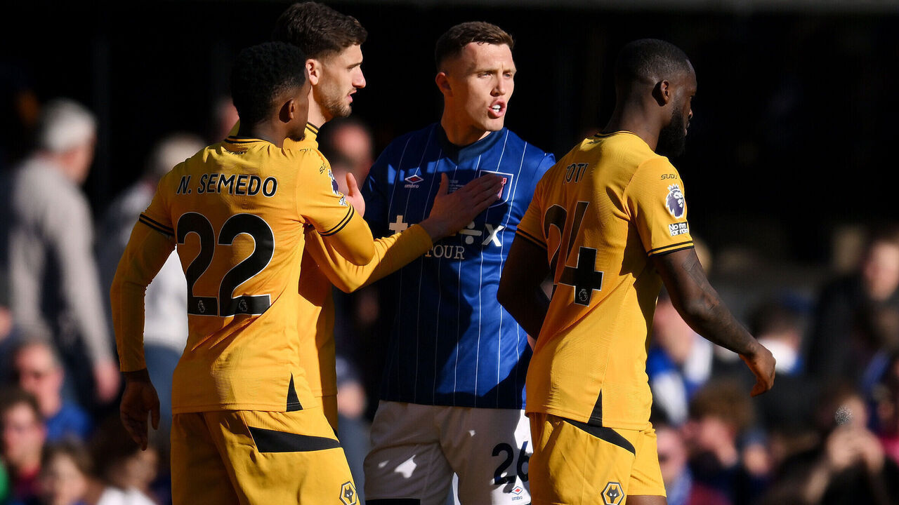 IPSWICH, ENGLAND - APRIL 05: Nelson Semedo of Wolverhampton Wanderers holds back Dara O'Shea of Ipswich Town as he clashes with Toti Gomes of Wolverhampton Wanderers after the Premier League match between Ipswich Town FC and Wolverhampton Wanderers FC at Portman Road on April 05, 2025 in Ipswich, England.