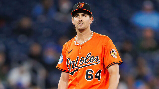 TORONTO, CANADA - MARCH 29: Dean Kremer #64 of the Baltimore Orioles pauses as he works the mound during their MLB game against the Toronto Blue Jays at Rogers Centre on March 29, 2025 in Toronto, Ontario, Canada.