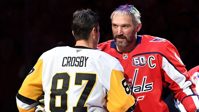 WASHINGTON, DC - NOVEMBER 08: Penguins center Sidney Crosby (87) and Capitals left wing Alexander Alex Ovechkin (8) shake hands after a ceremonial puck drop before the Pittsburgh Penguins versus Washington Capitals National Hockey League game on November 8, 2024 at Capital One Arena in Washington, D.C..