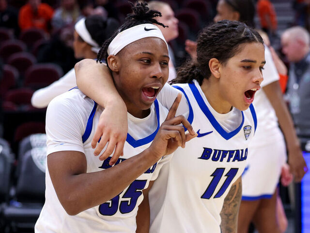 CLEVELAND, OH - MARCH 12: Buffalo Bulls guard Chellia Watson (35) and Buffalo Bulls guard Mallory Daly (2) celebrates following the MAC Women's Basketball Tournament Quarterfinal game between the Bowling Green Falcons and Buffalo Bulls on March 12, 2025, at Rocket Arena in Cleveland, OH.