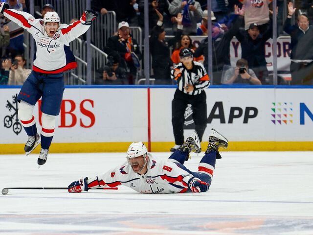 ELMONT, NY - APRIL 6: Alex Ovechkin #8 of the Washington Capitals celebrates as he scores his 895th career NHL goal, breaking the record of 894 goals set by Wayne Gretzky during a game against the New York Islanders at UBS Arena on April 6, 2022 in Elmont, N.Y.