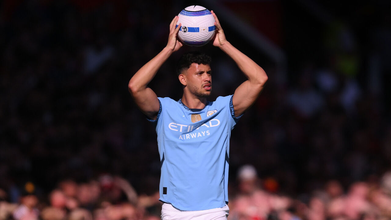 MANCHESTER, ENGLAND - APRIL 06: Matheus Nunes of Manchester City takes a throw in during the Premier League match between Manchester United FC and Manchester City FC at Old Trafford on April 06, 2025 in Manchester, England.