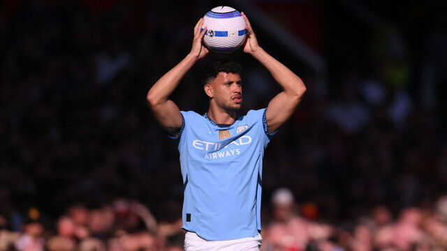 MANCHESTER, ENGLAND - APRIL 06: Matheus Nunes of Manchester City takes a throw in during the Premier League match between Manchester United FC and Manchester City FC at Old Trafford on April 06, 2025 in Manchester, England.