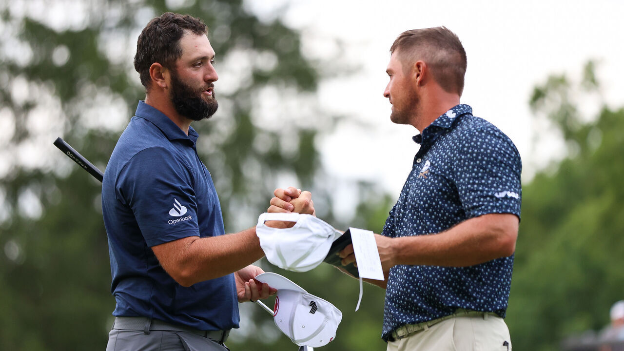 WHITE SULPHUR SPRINGS, WEST VIRGINIA - AUGUST 16: Jon Rahm of Spain hand shakes Bryson DeChambeau of the United States after finishing the 18th hole during day one of LIV Golf: Greenbrier at The Old White Course on August 16, 2024 in White Sulphur Springs, West Virginia.