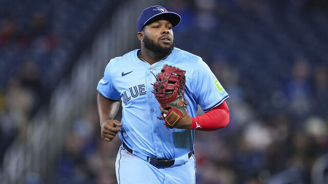 TORONTO, ON - MARCH 31: Vladimir Guerrero Jr. #27 of Toronto Blue Jays jogs off the field in the middle of the first inning against the Washington Nationals in their MLB game at the Rogers Centre on March 31, 2025 in Toronto, Ontario, Canada.